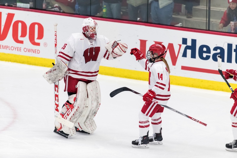 Wisconsin Badgers Alexis Mauermann (14) celebrates a goal with goalie Kristen Campbell (35) during an NCAA women's hockey game against the Ohio State Buckeyes Sunday, November 5, 2017, in Madison, Wis. The Badgers won 3-1. (Photo by David Stluka)