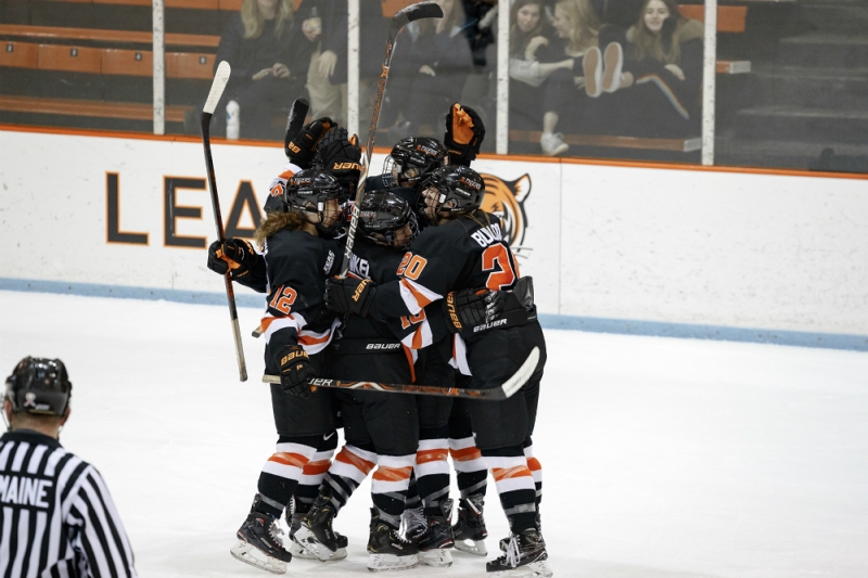 Princeton's women's ice hockey players, including Carly Bullock, Sharon Frankel, and Annie MacDonald, celebrate a goal at Hobey Baker Rink. (Shelley Szwast/Princeton Athletics)